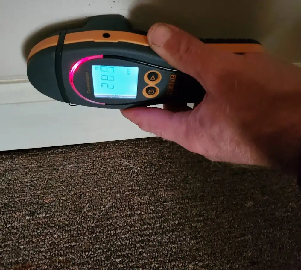 Moisture detection at baseboard during Burst Pipe Cleanup in Corinth